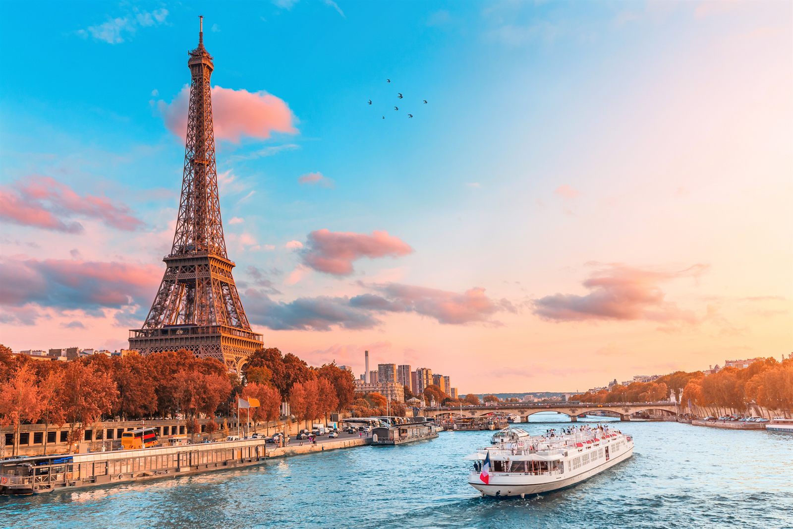 Eiffel Tower at sunset above the Seine