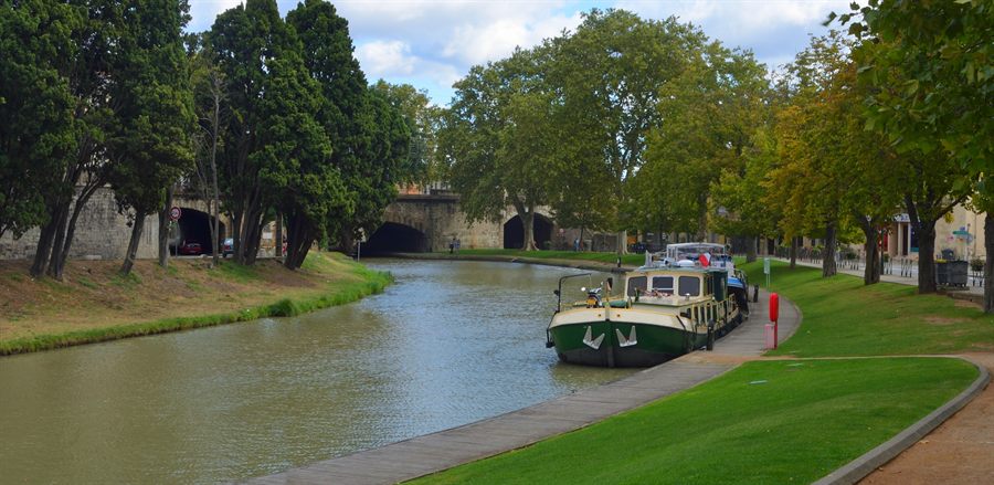 Small cruise barge on the Canal du Midi near Carcassonne