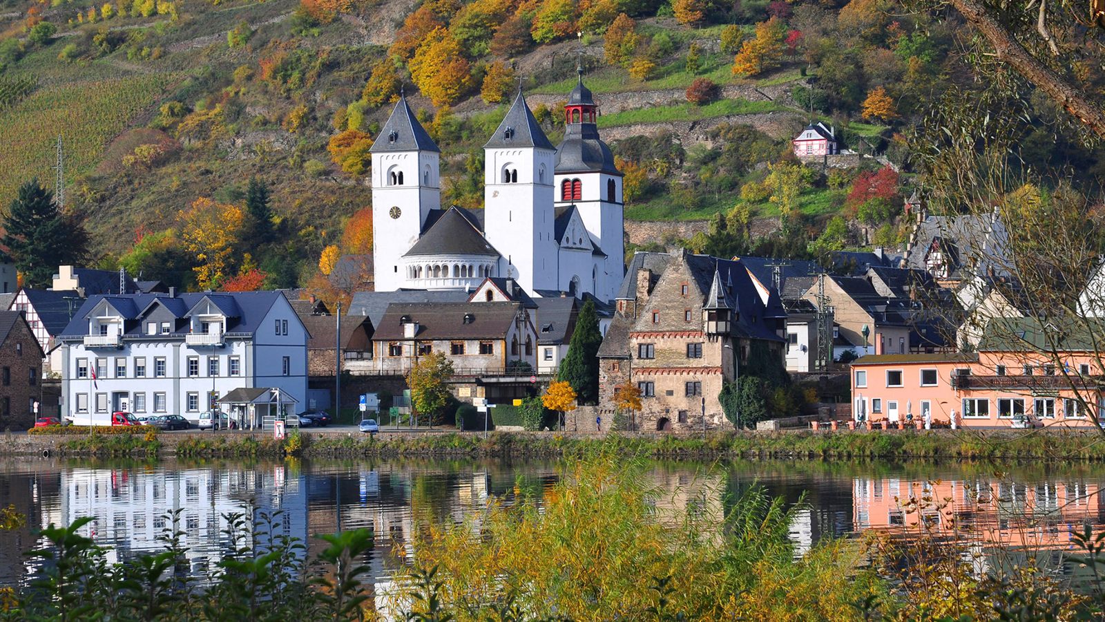 Moselle wine village reflected in the river